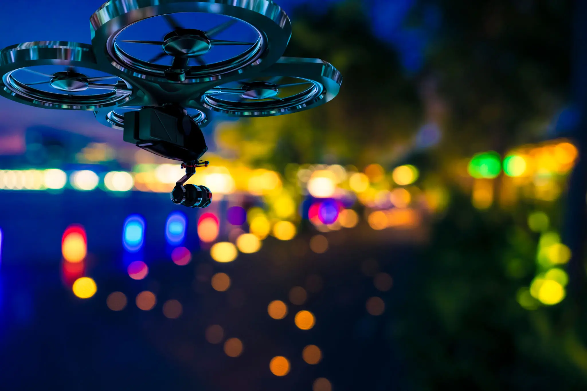 Drone flying over colorful city lights