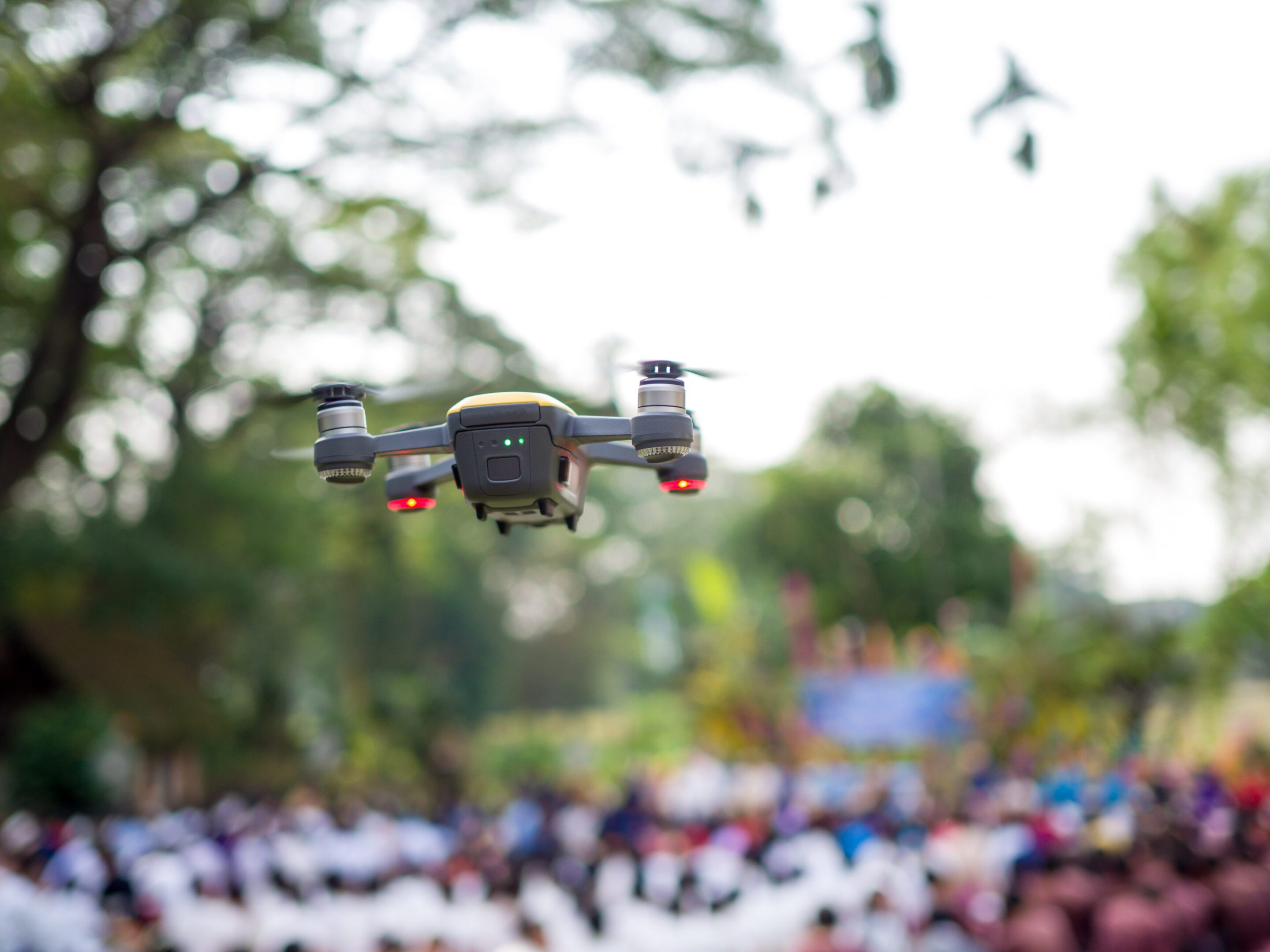 Drone hovering over outdoor event