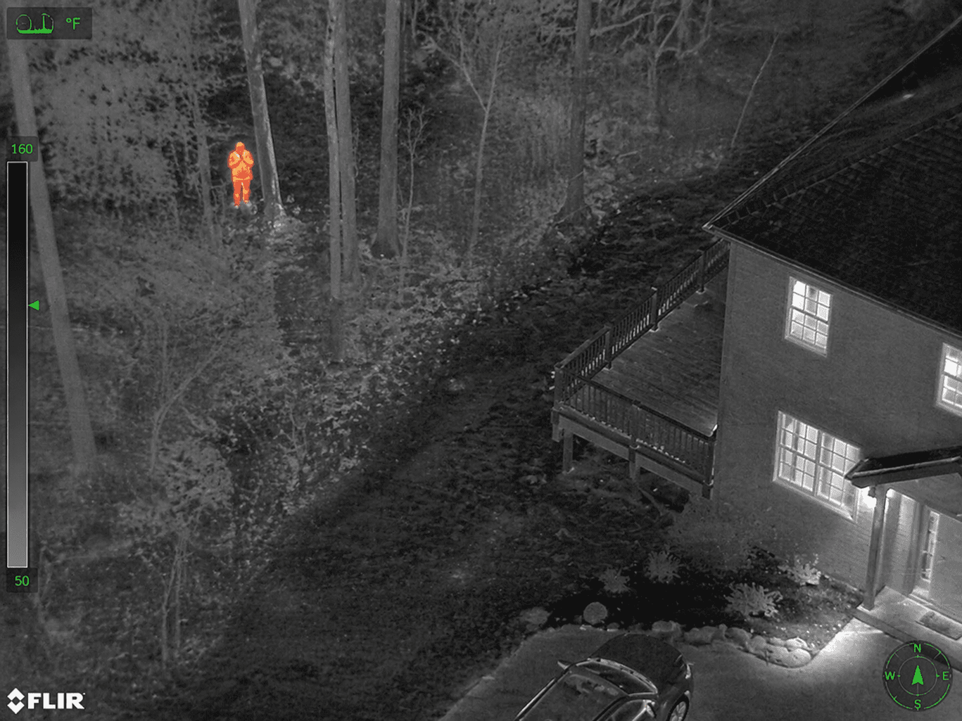 Infrared view of wooded area and house