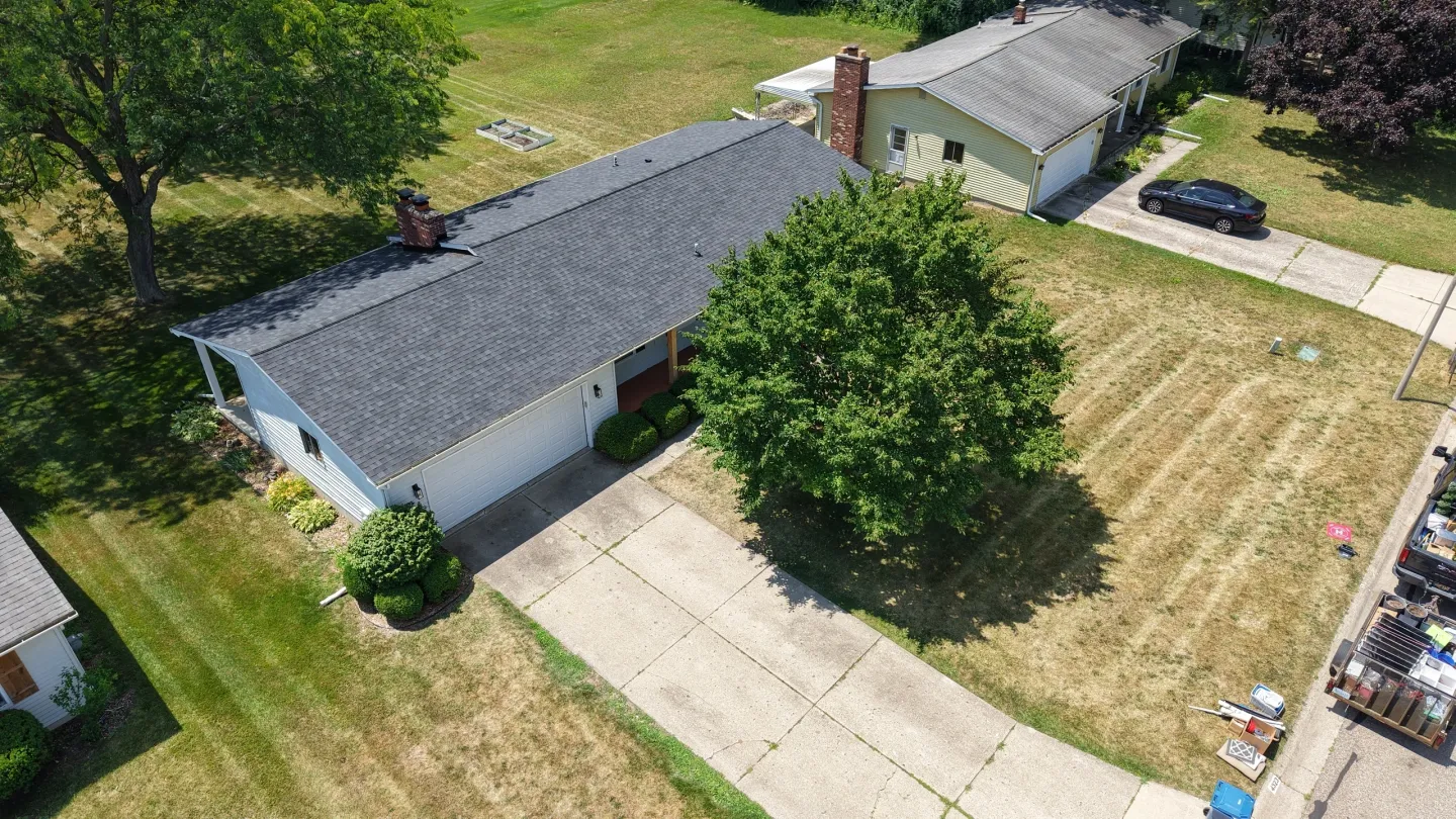 House and tree in front yard