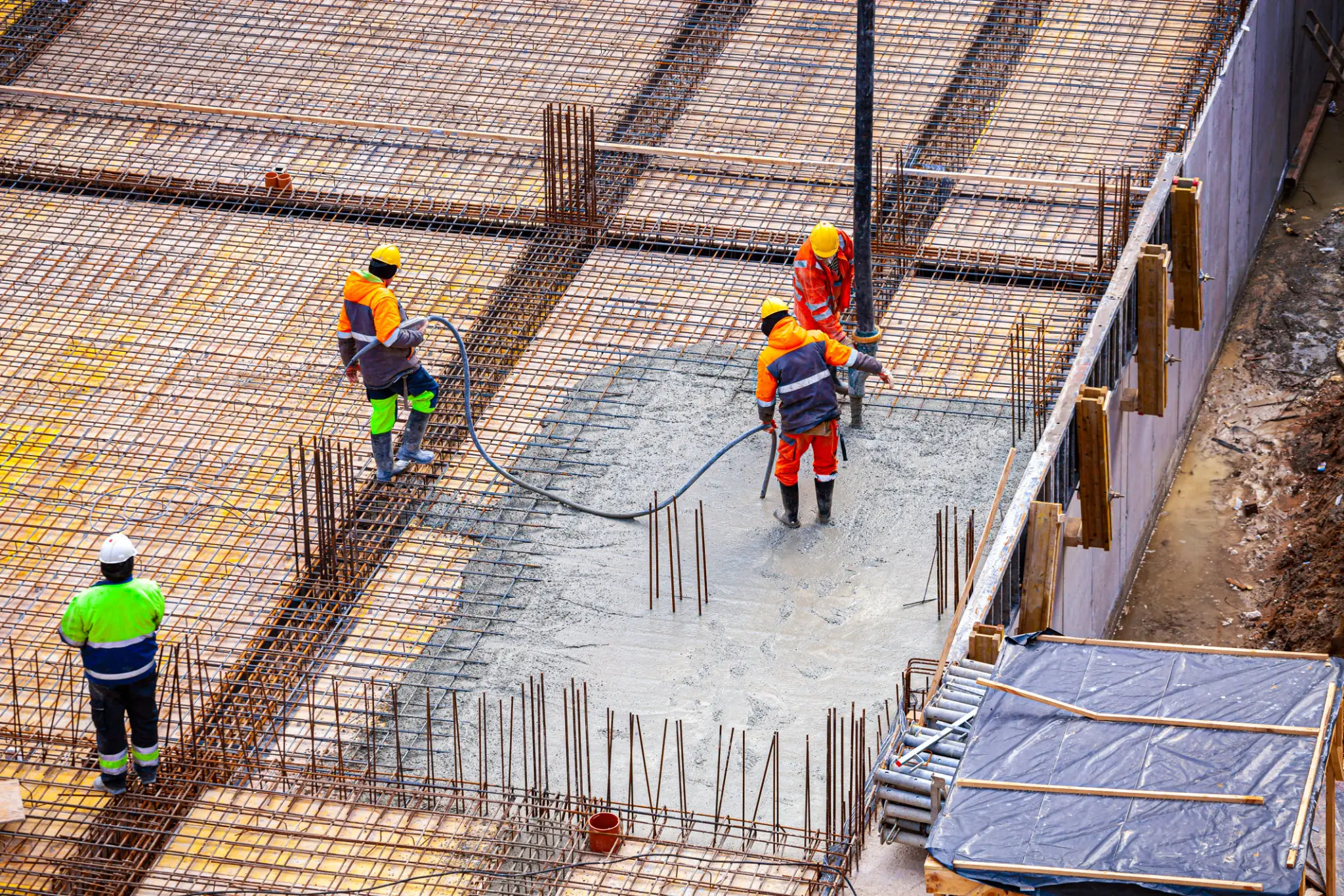 Workers in safety gear at construction site