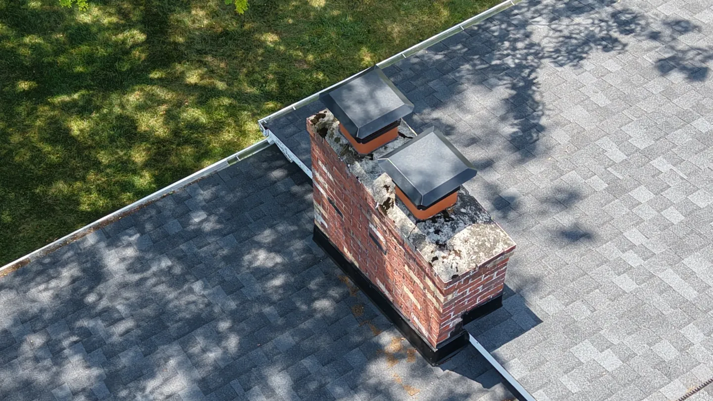 Dual chimney vents on rooftop