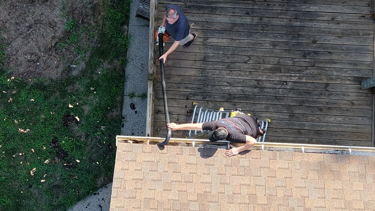 Overhead view of gutter cleaning activity